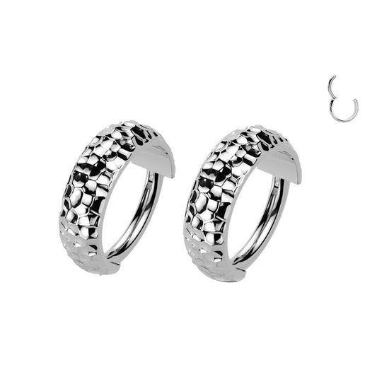 Pair of silver hoop earrings with textured design.