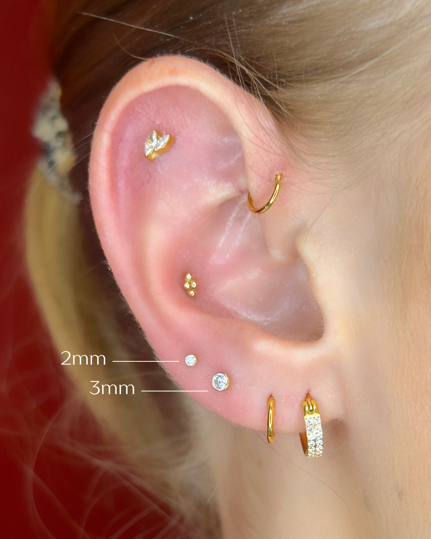 Close-up picture showing the earrings on a real ear.