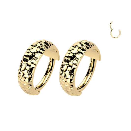 Pair of gold hoop earrings with textured design.