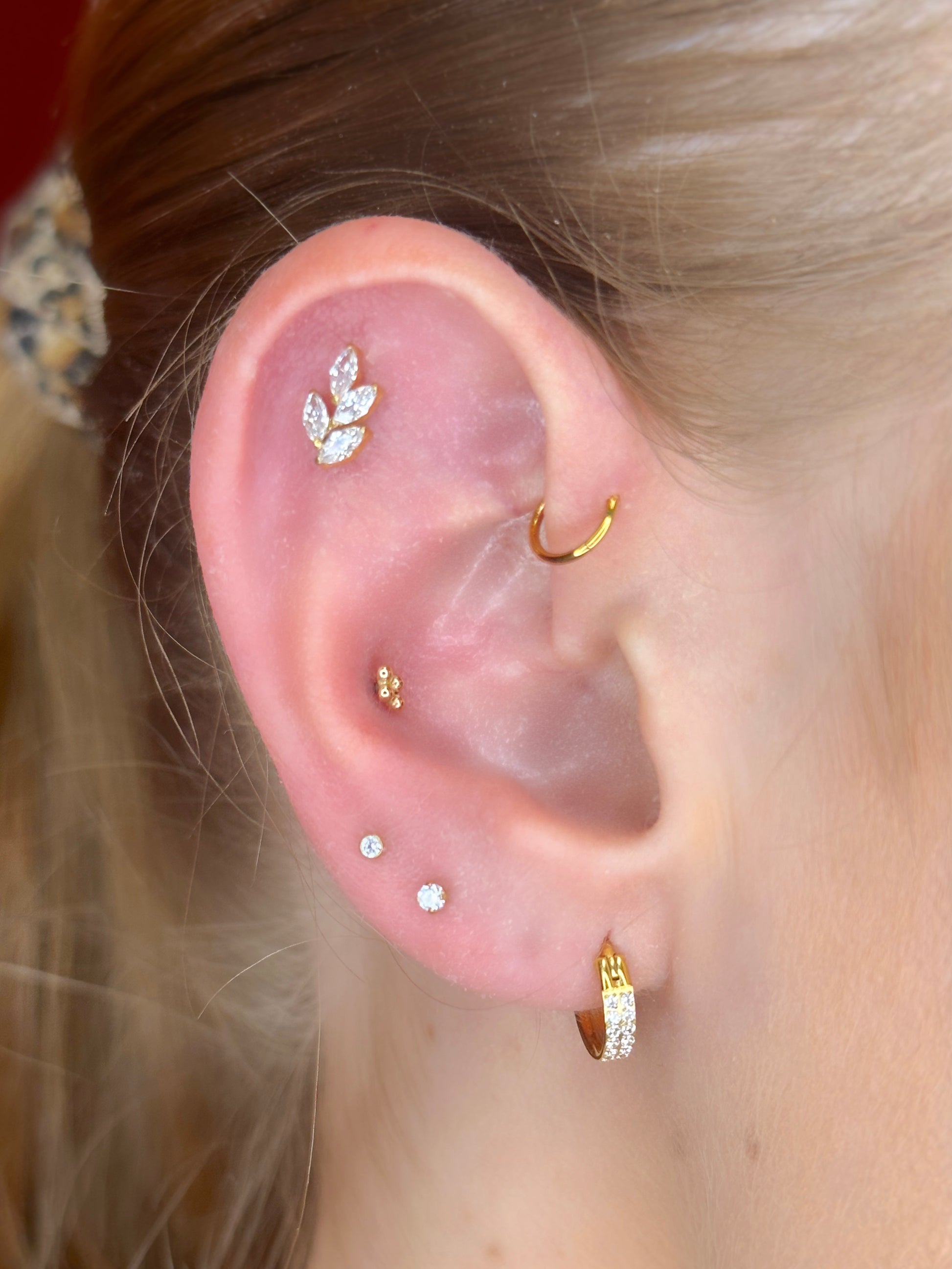 Close-up picture showing the earrings on a real ear.
