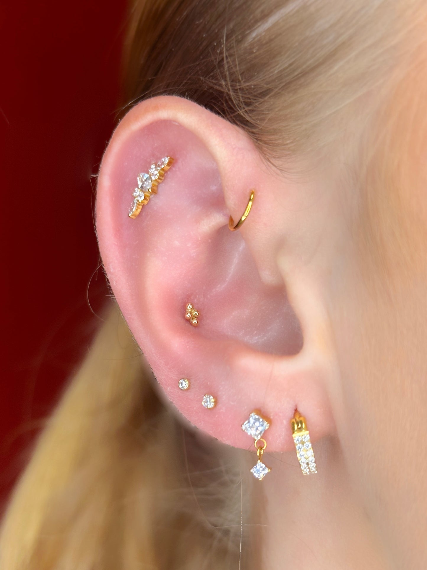 Close-up picture showing the earrings on a real ear.