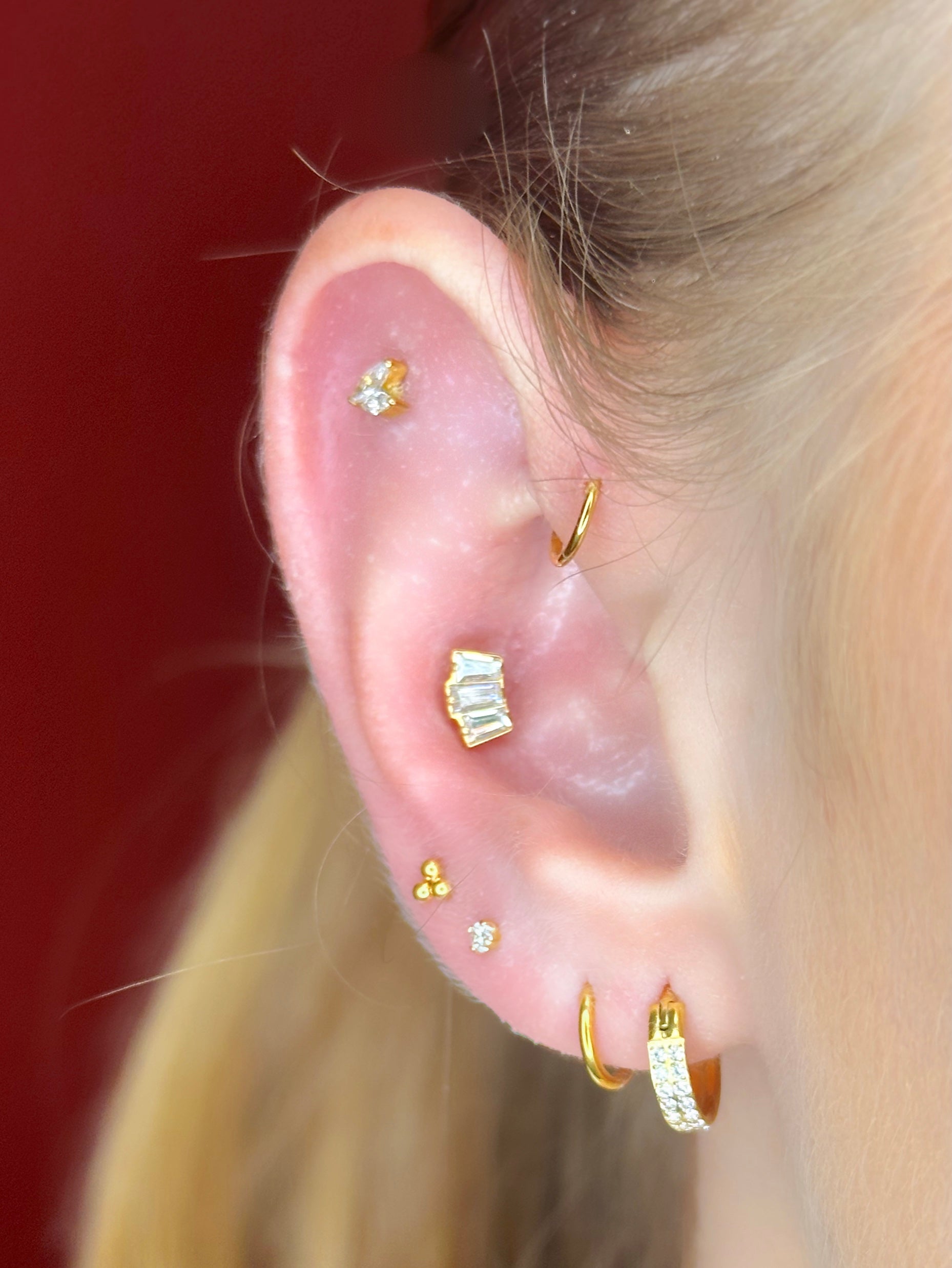 Close-up picture showing the earrings on a real ear.