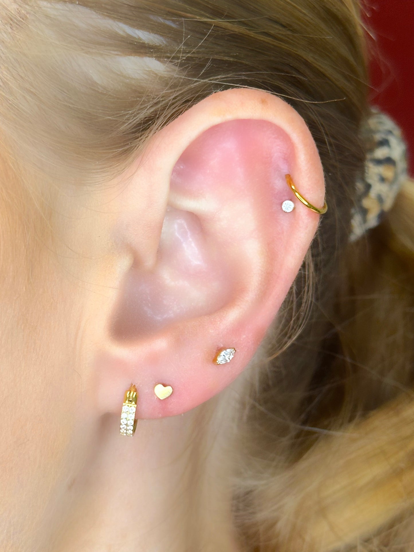 Close-up picture showing the earrings on a real ear.