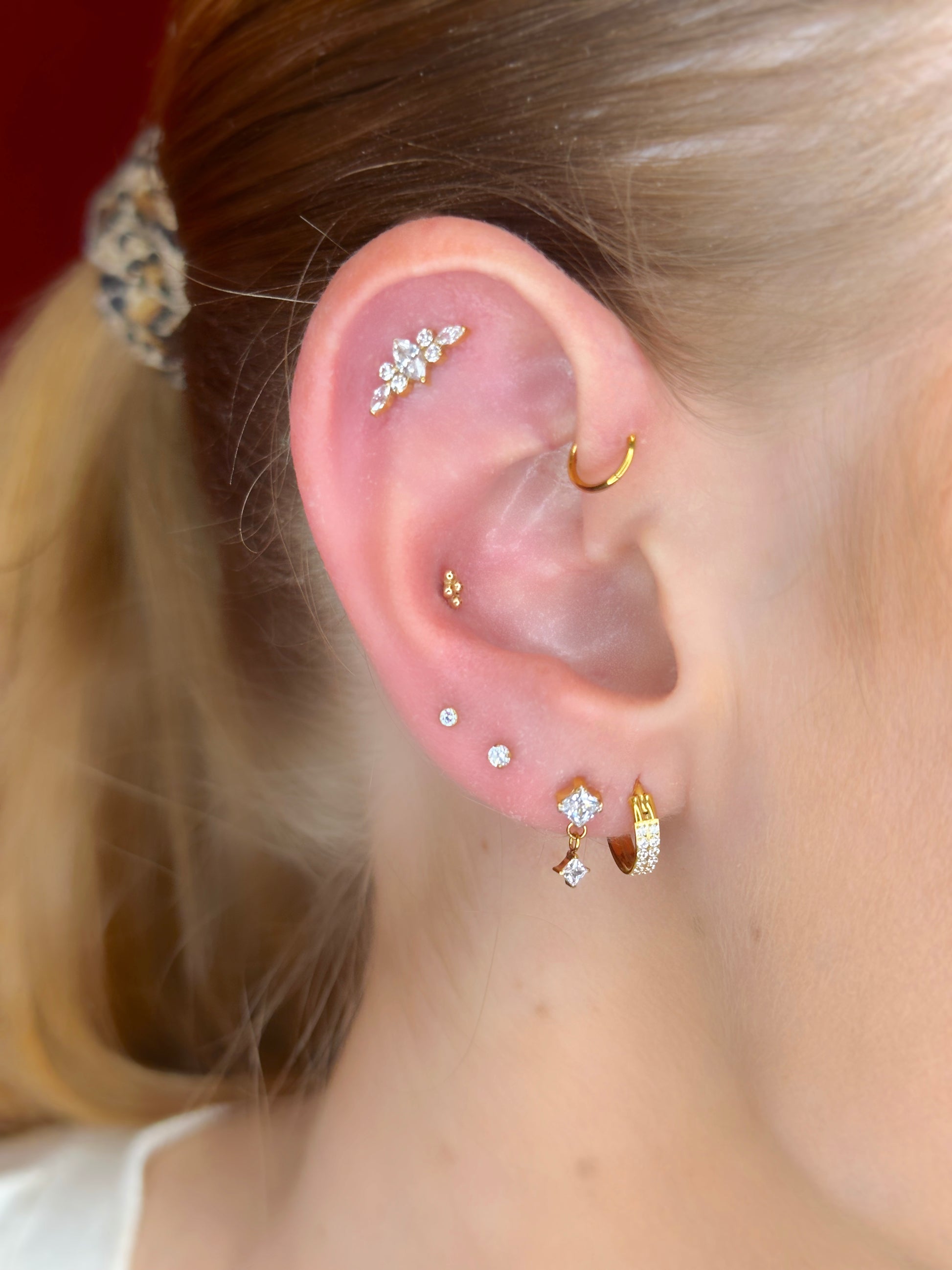 Close-up picture showing the earrings on a real ear.