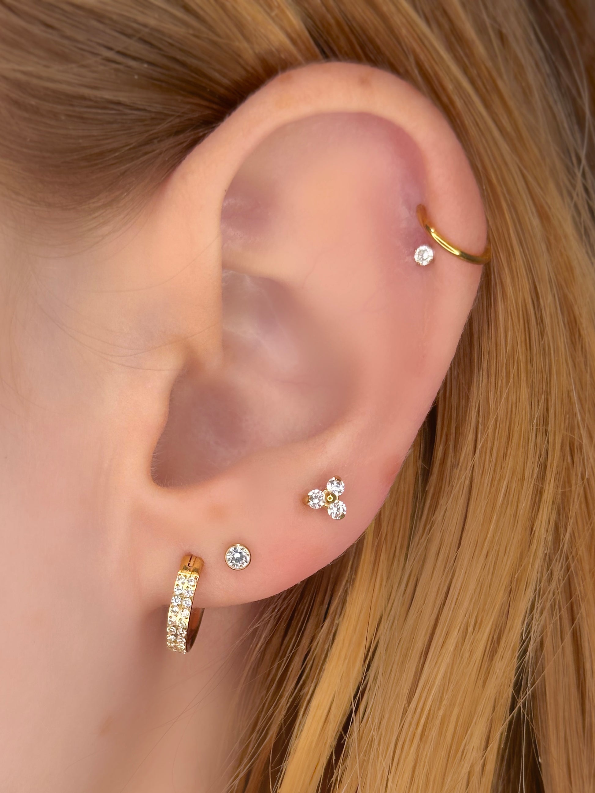 Close-up picture showing the earrings on a real ear.